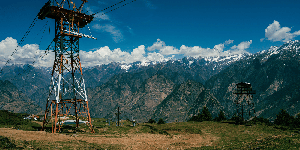 Snow-covered ski slopes of Auli with Himalayan peaks, Uttarakhand