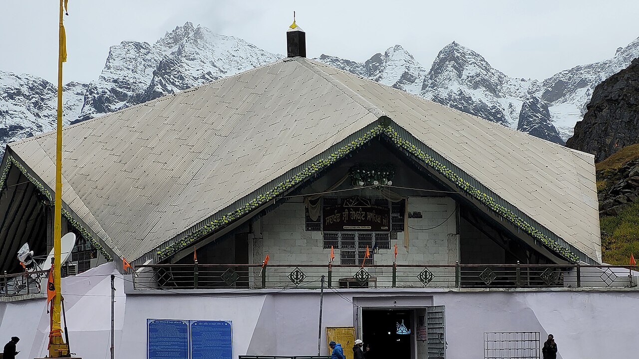 Gurudwara Sri Hemkund Sahib Ji beside the glacial lake, ringed by snow-capped Himalayan peaks
